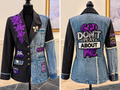 Front and back of a denim and black pinstripe blazer with purple floral accents and faith-inspired patches