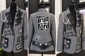 Front and back views of a gray faith-inspired blazer with black floral appliqués, pearl-style chains, patches, and Trust in the Lord back design.
